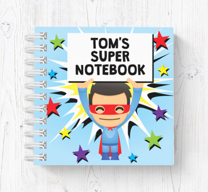 superhero holding sign mini notebook