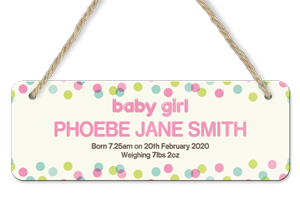 personalised dotty baby girl announcement hanging door sign