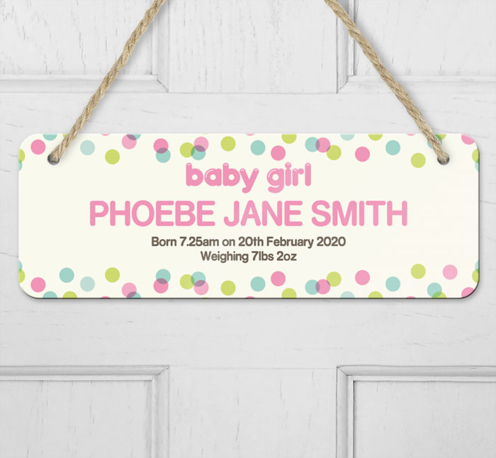 personalised dotty baby girl announcement hanging door sign